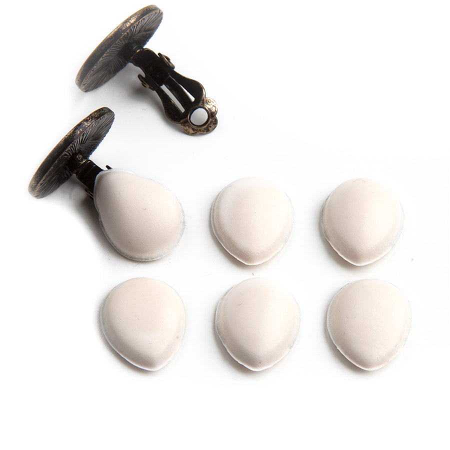 3 pairs of clip earrings with one pair of clip earrings showing how cushions fit on clip earring back.
