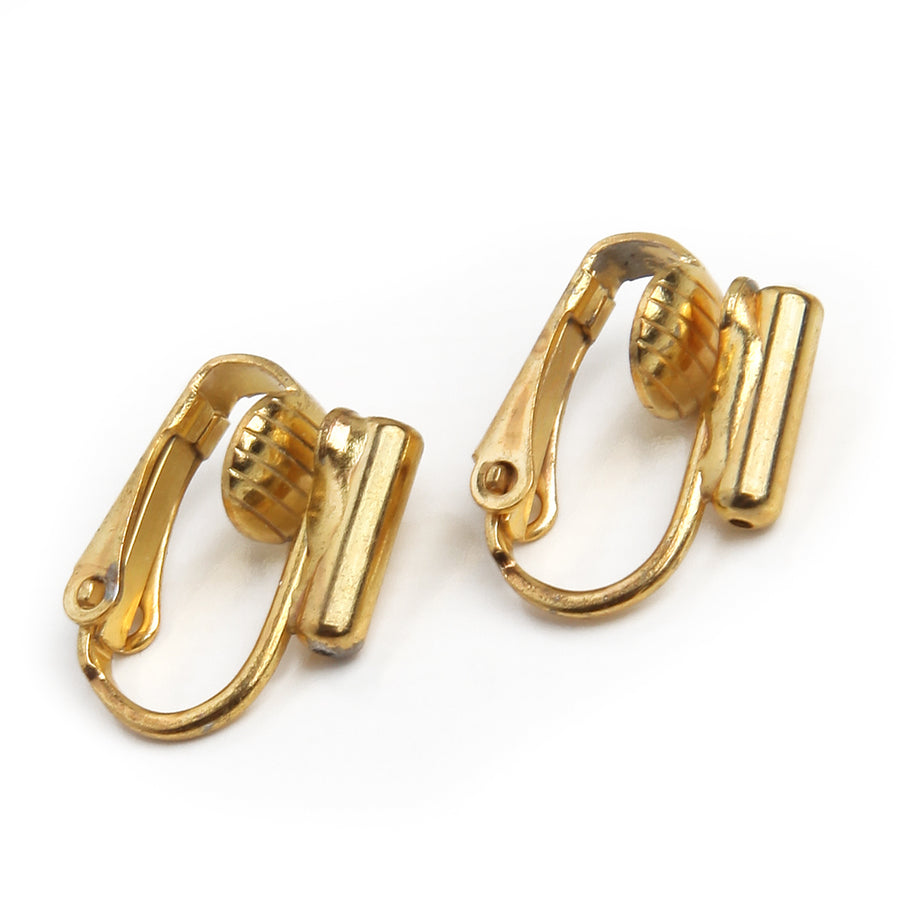 post to clip on earring converters in goldtone on a white background