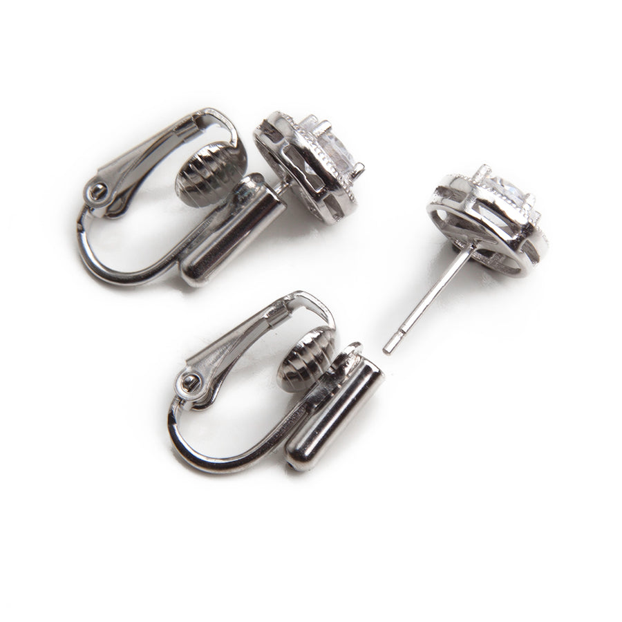 one pair of silvertone post to clip earring converters with a pair of bezeled gemstone earrings showing how earrings fit into converters on white background.