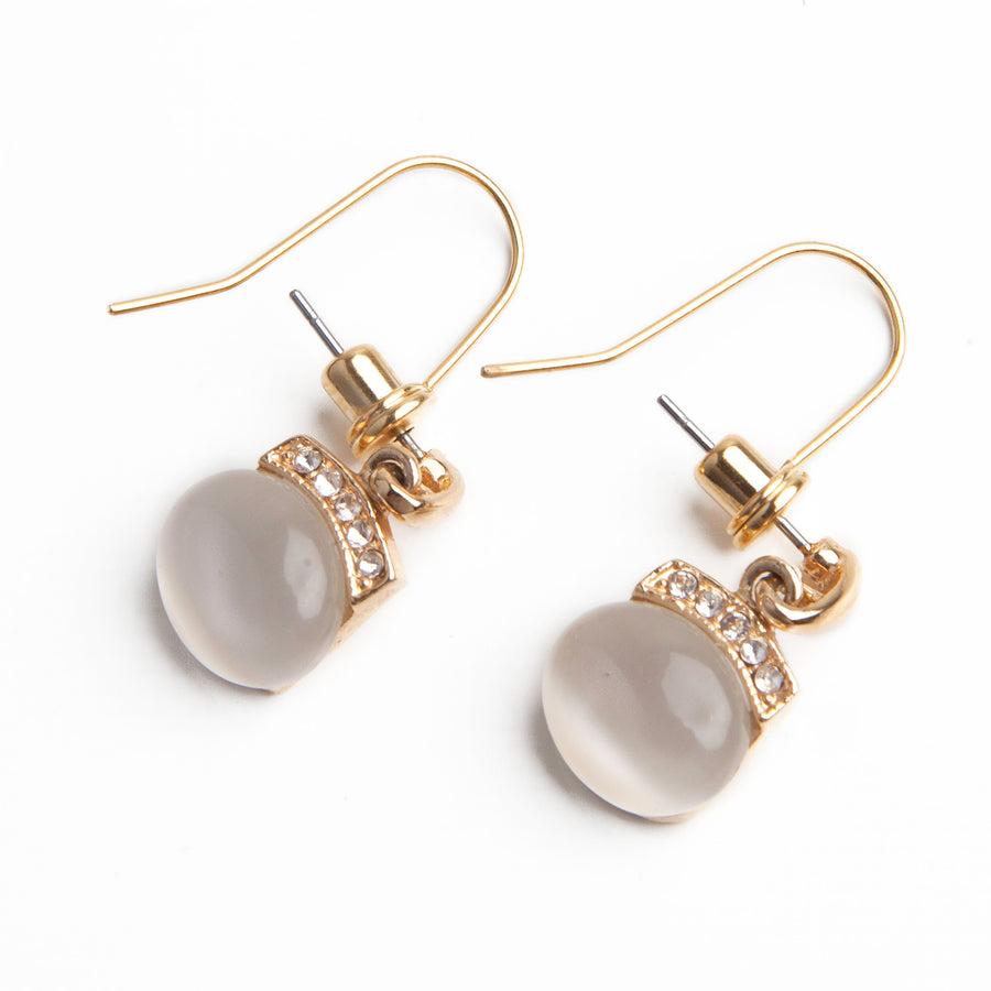 Gold Post to Wire Earring Converters attached to a pair of gold and tiger eye stud earrings.