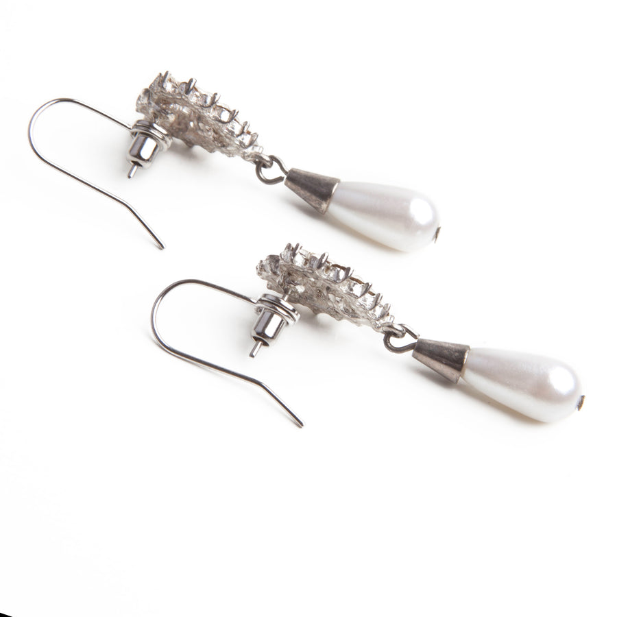 Silver Post to Wire Earring Converters attached to a pair of silver and pearl dangle stud earrings.