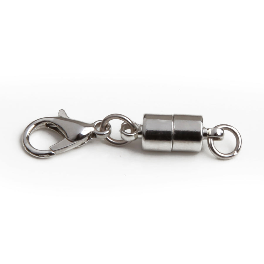 one small silver barrel magnetic clasp.