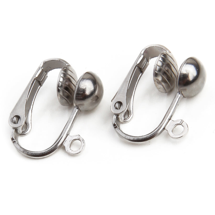 two fish hook to clip on earring converters on a white background