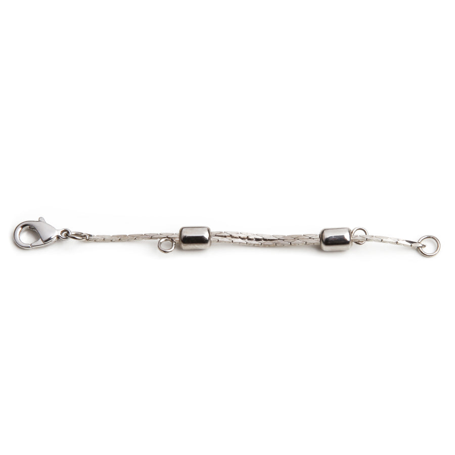One silver adjustable necklace extender laid out on a white background.