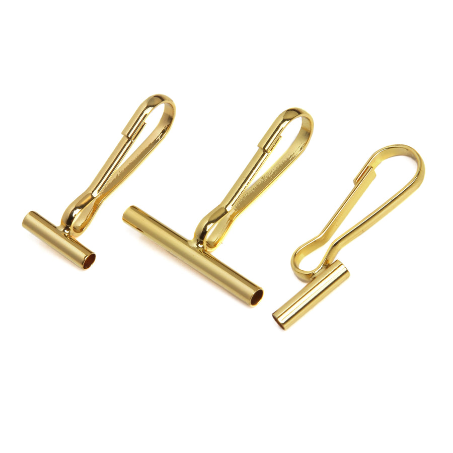 One small horizontal pin converter, one large horizontal pin converter, and one vertical pin converter all in gold on a white background.