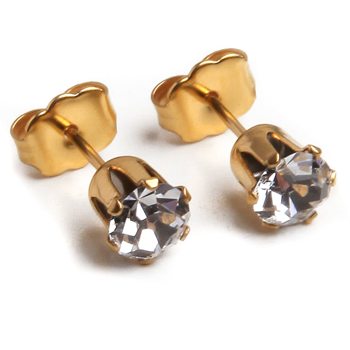 clear 5mm april birthstone gemstones in gold plated stainless steel setting against white background