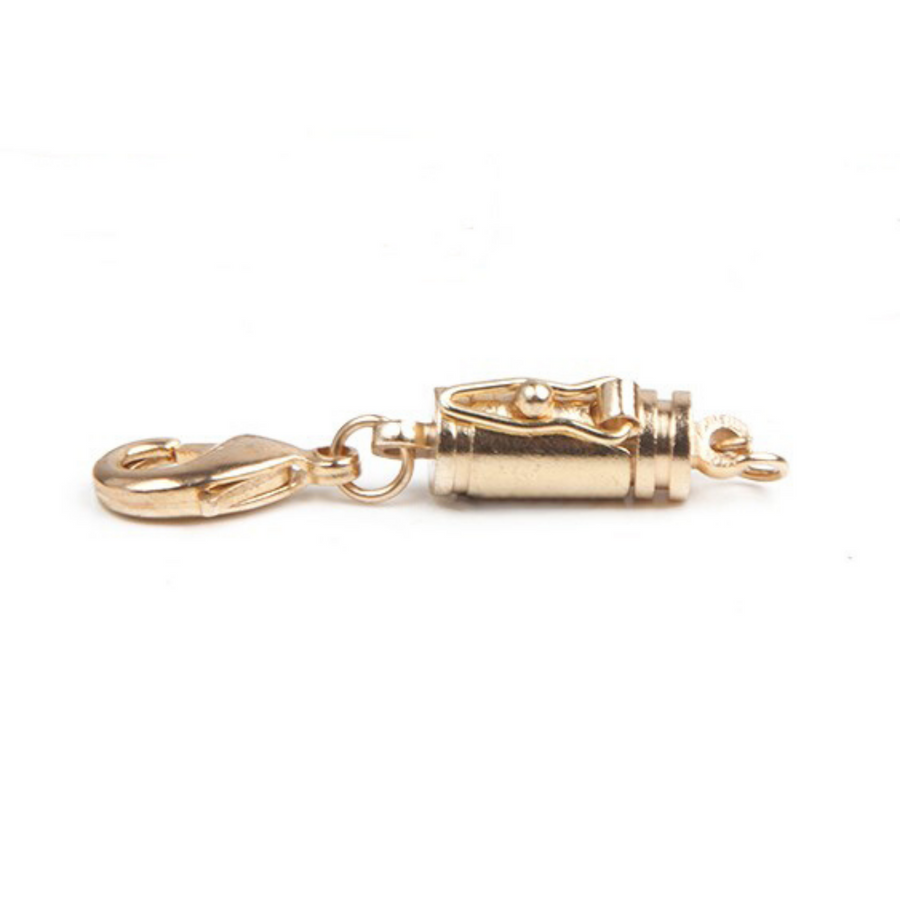goldtone small barrel magnetic clasp with a safety catch on one side.